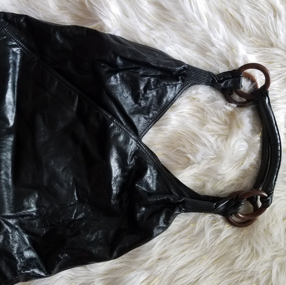 Black bag with wooden rings